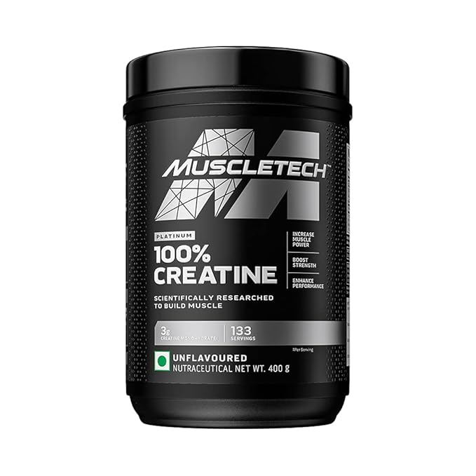 MuscleTech Creatine supplement displayed in a high-quality, eye-catching container with bold branding. The container is black and yellow, showcasing the MuscleTech logo prominently. Beside it, a shaker bottle filled with water and a scoop of creatine powder, ready to mix for a pre-workout boost. The background features a gym with modern equipment, highlighting an active and focused fitness environment. The image reflects MuscleTech’s commitment to delivering powerful supplements for muscle growth, strength, and performance