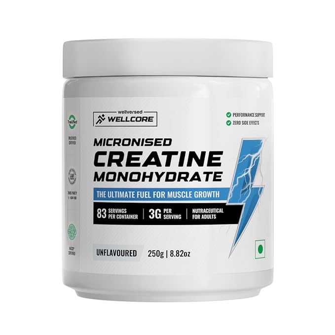 Wellcore Creatine supplement displayed in a sleek, modern container on a fitness countertop. The container is black with bold, vibrant lettering showcasing the Wellcore brand. Next to it, a clear shaker bottle filled with water and a scoop of creatine powder, ready for mixing. The background features a well-equipped gym with weights and fitness machines, creating a dynamic, energetic atmosphere. The scene emphasizes the quality and effectiveness of Wellcore Creatine, designed to support muscle strength, endurance, and overall athletic performance.