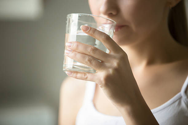 a women is drinking water at chennai for weight loss