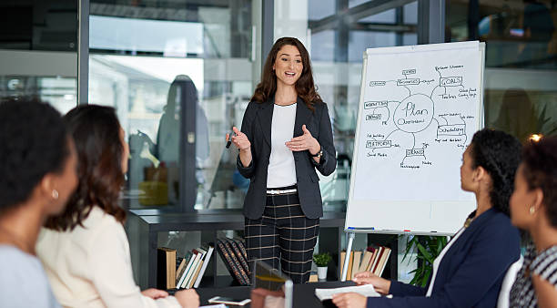 Shot of an attractive young businesswoman giving a presentation in the boardroom , chennai , weight loss , busy weight loss