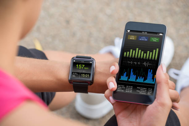 Female Runner Looking At Her Mobile And Smart Watch Heart Rate Monitor , chennai , busy , people, busy people
